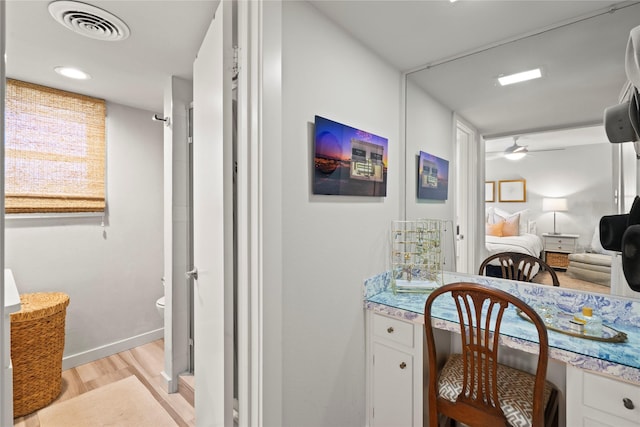 interior space with light hardwood / wood-style flooring and ceiling fan