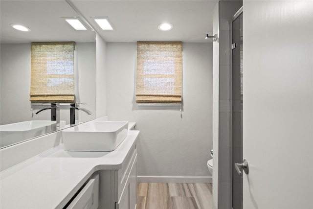 laundry room with sink and light hardwood / wood-style flooring