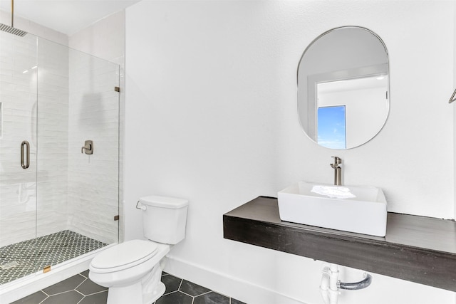 bathroom featuring sink, toilet, tile patterned flooring, and a shower with shower door