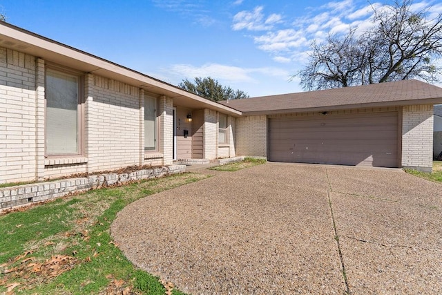 ranch-style home featuring a garage