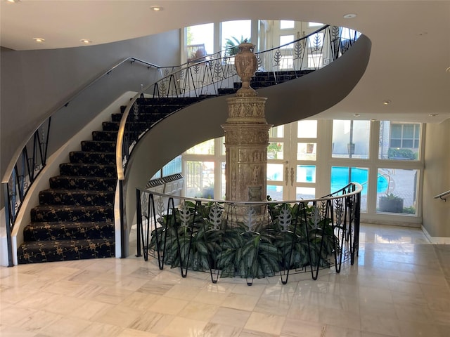 stairway with tile patterned floors