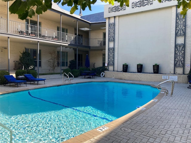 view of swimming pool featuring a patio