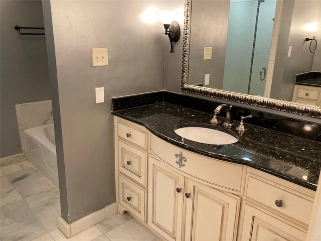 bathroom featuring plus walk in shower, tile patterned floors, and vanity