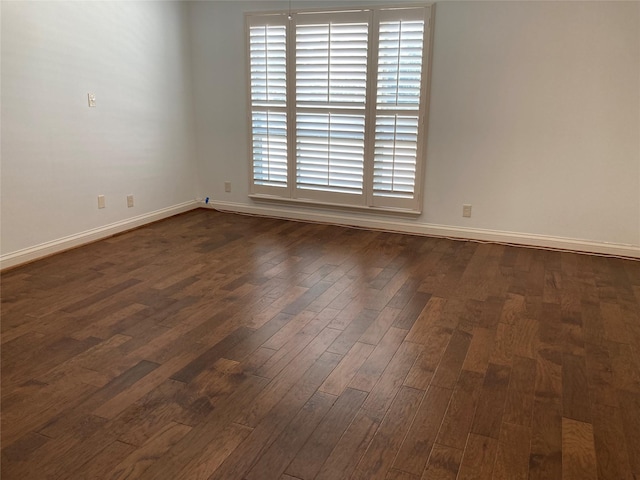 unfurnished room featuring dark hardwood / wood-style flooring