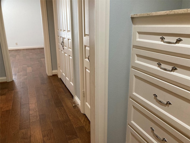 corridor featuring dark hardwood / wood-style flooring