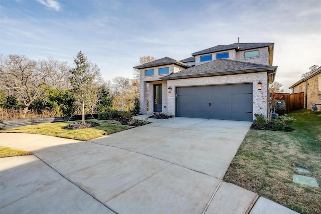 view of front of home with a garage and a front yard