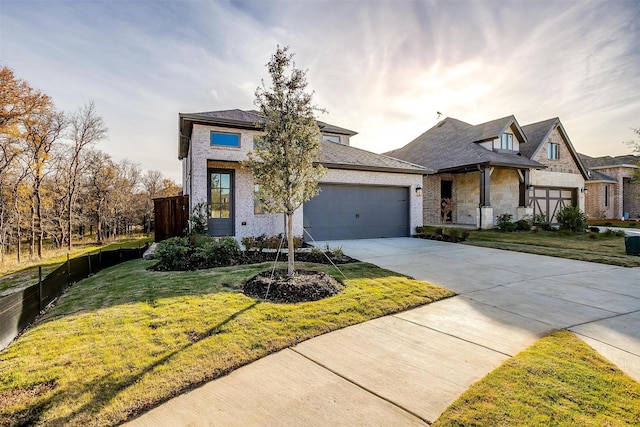 view of front facade with a garage and a front yard