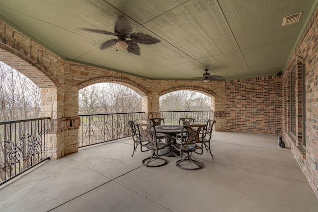 view of patio featuring ceiling fan