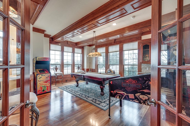 recreation room with wood-type flooring, billiards, and crown molding