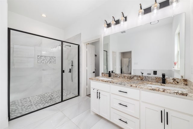 bathroom featuring tile patterned flooring, walk in shower, and vanity