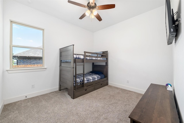 bedroom featuring ceiling fan and light colored carpet