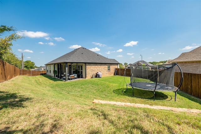 view of yard with a trampoline