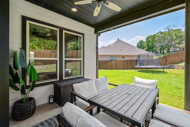 view of patio / terrace featuring ceiling fan and a trampoline