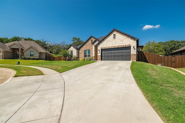 view of front of property with a garage and a front yard