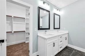 bathroom with vanity and tile patterned floors