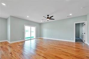 empty room featuring wood-type flooring and ceiling fan