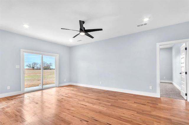 unfurnished room featuring ceiling fan, light wood-style flooring, recessed lighting, visible vents, and baseboards