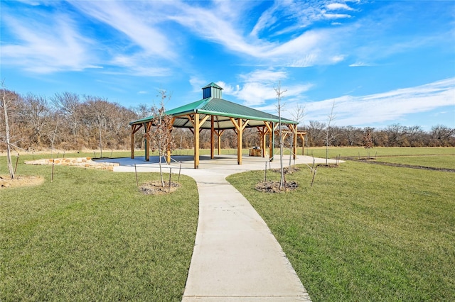 surrounding community with a yard and a gazebo