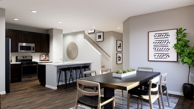 dining space with dark wood-type flooring