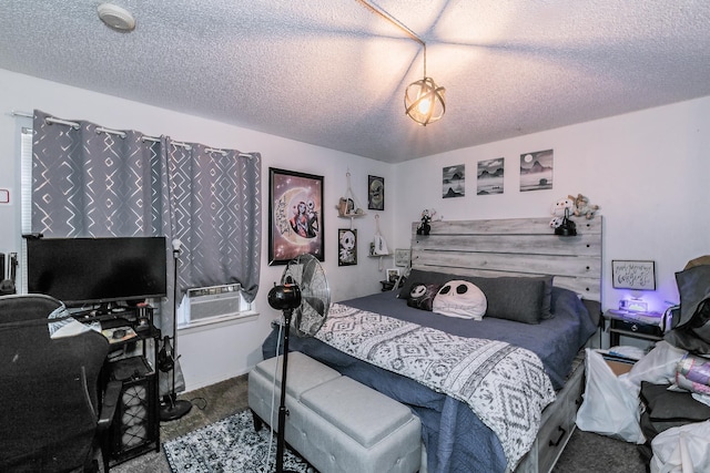 carpeted bedroom with a textured ceiling