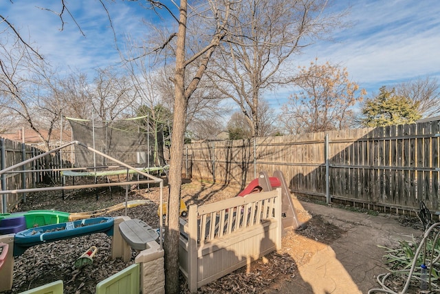 view of yard featuring a trampoline