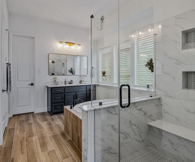 bathroom with vanity and plus walk in shower