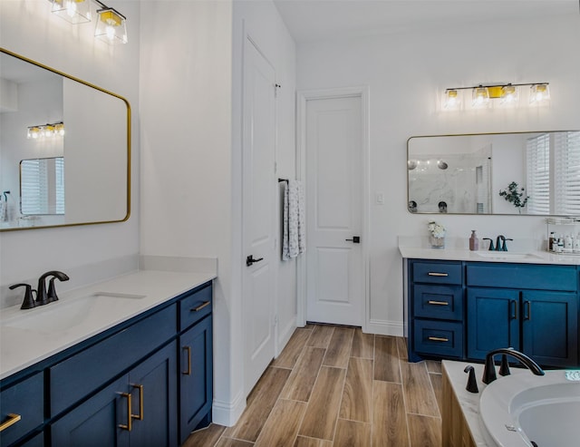 bathroom with vanity and a shower