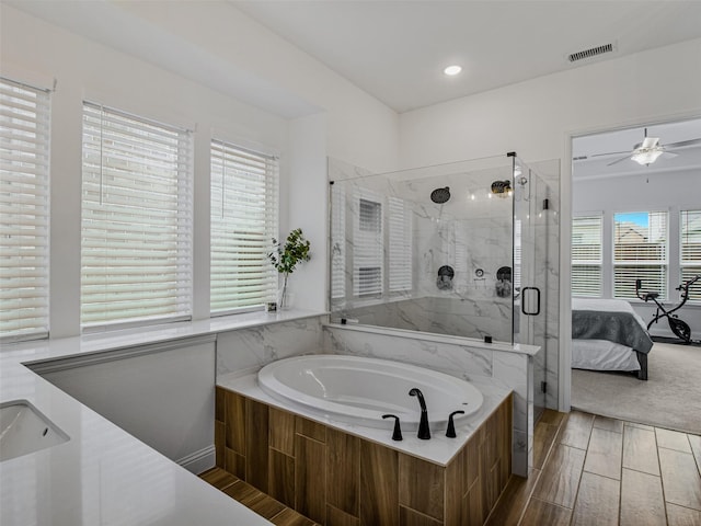 bathroom with sink, independent shower and bath, and ceiling fan