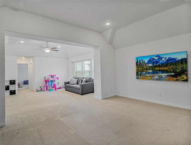 playroom with ceiling fan, light carpet, and lofted ceiling