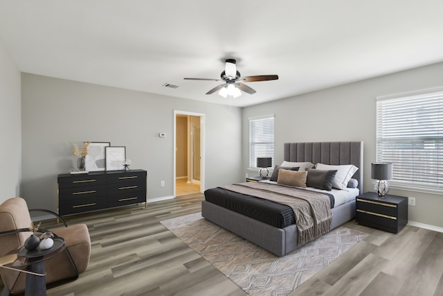 bedroom with ceiling fan and light hardwood / wood-style flooring