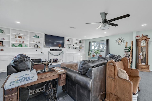 living area featuring recessed lighting, visible vents, and a ceiling fan