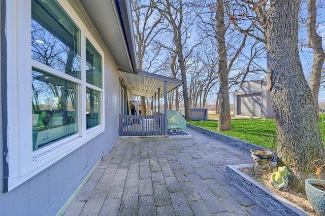 view of patio / terrace with an outbuilding