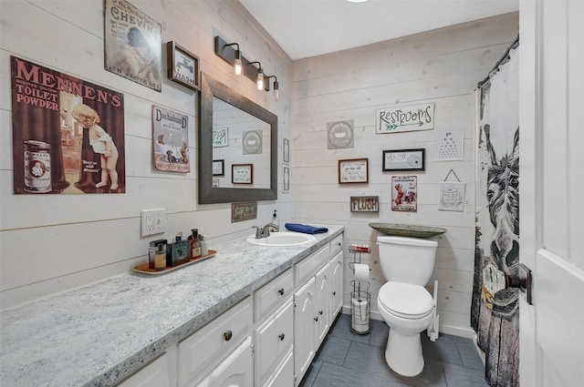 bathroom featuring toilet, curtained shower, and vanity