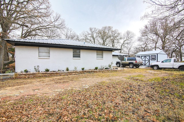 view of property exterior featuring a shed