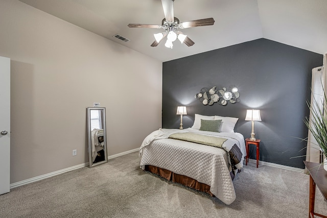 carpeted bedroom featuring lofted ceiling and ceiling fan