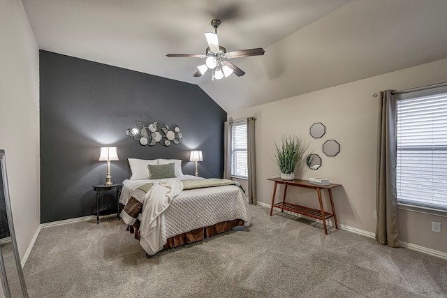 carpeted bedroom featuring ceiling fan and lofted ceiling