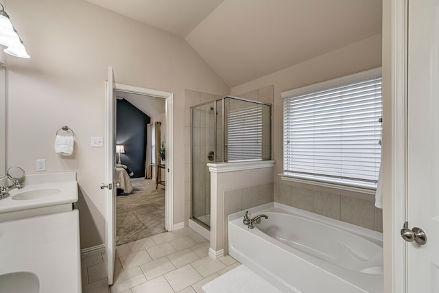 bathroom featuring independent shower and bath, tile patterned floors, lofted ceiling, and vanity