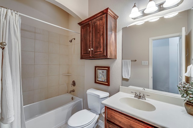 full bathroom featuring toilet, shower / bathtub combination with curtain, and vanity