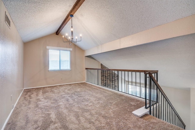 bonus room featuring carpet floors, a textured ceiling, an inviting chandelier, and vaulted ceiling with beams