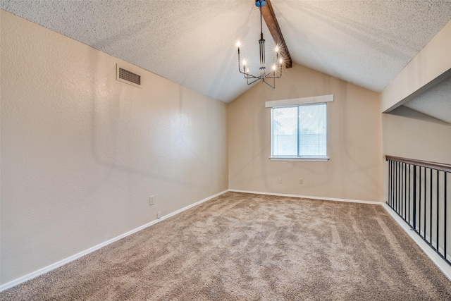 empty room featuring a notable chandelier, carpet, vaulted ceiling with beams, and a textured ceiling