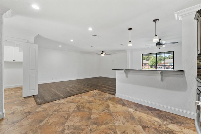 interior space with ceiling fan, hardwood / wood-style flooring, and crown molding