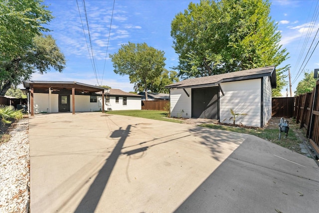 view of front of property with a shed