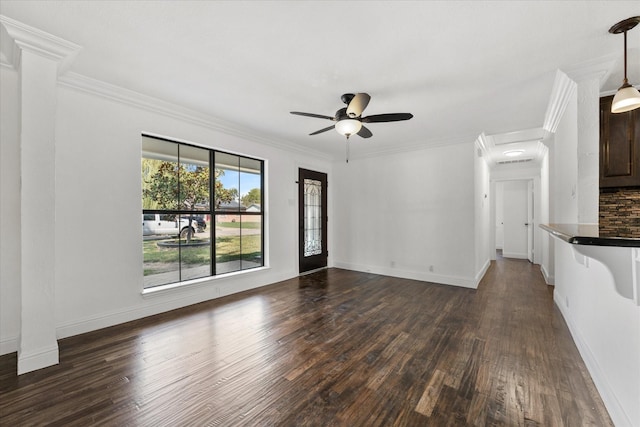 unfurnished living room featuring ceiling fan, dark hardwood / wood-style flooring, and crown molding