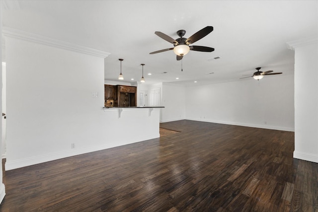 unfurnished living room featuring dark hardwood / wood-style floors, ceiling fan, and ornamental molding