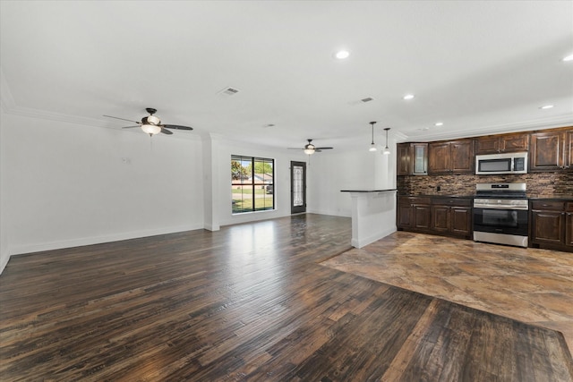 kitchen featuring pendant lighting, appliances with stainless steel finishes, tasteful backsplash, ornamental molding, and dark brown cabinets