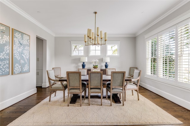 dining space featuring dark wood-type flooring, crown molding, and a notable chandelier