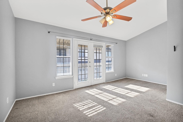 empty room with carpet floors, ceiling fan, and french doors