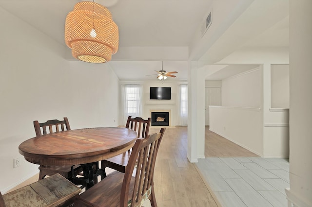 dining area featuring ceiling fan and light hardwood / wood-style flooring