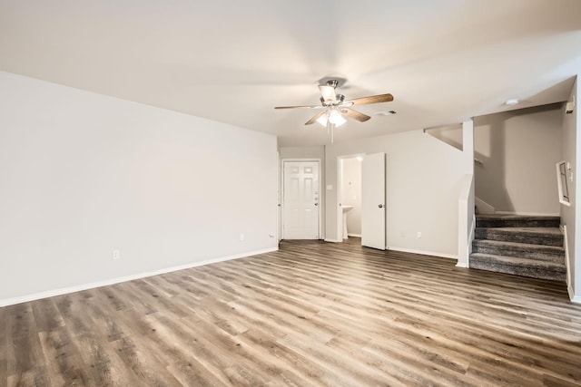 unfurnished living room with ceiling fan and hardwood / wood-style floors