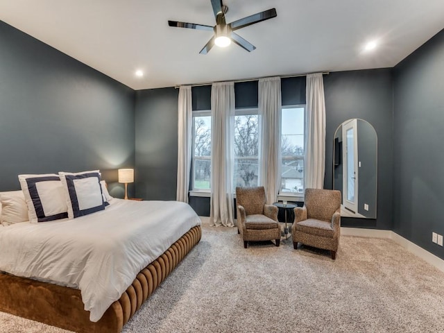 carpeted bedroom with ceiling fan